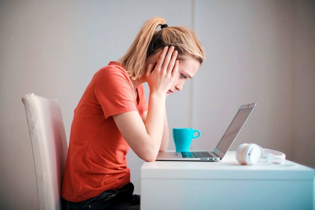 CBT therapy for hypochondria - woman at laptop