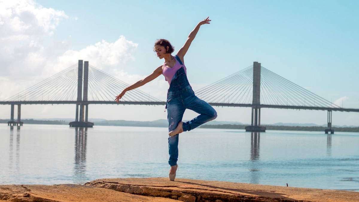 Does yoga help with anxiety? Yes, new study finds - - woman doing yoga near bridge