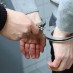New algorithm can predict future crime a week in advance - man in handcuffs