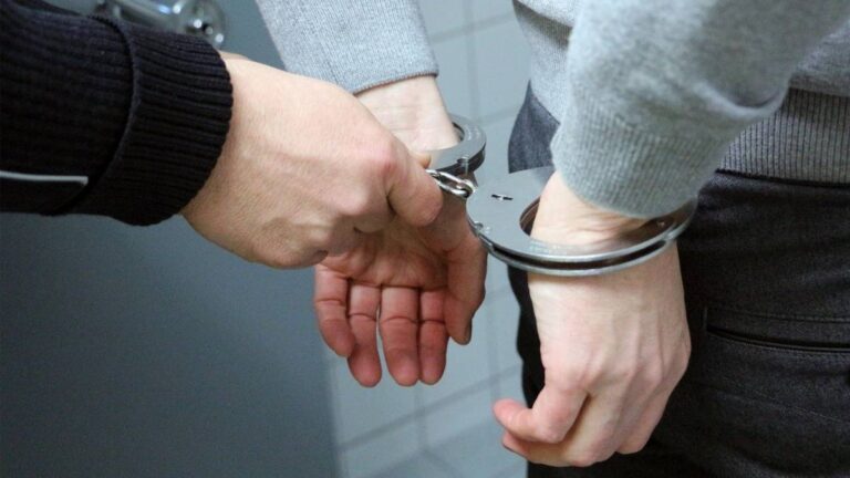 New algorithm can predict future crime a week in advance - man in handcuffs