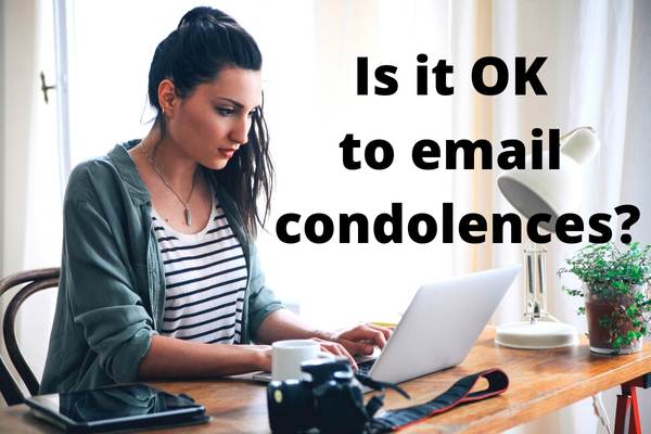Is it OK to email condolences - woman typing on laptop