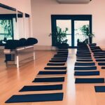 benefits of chair yoga -row of yoga chairs in a yoga studio